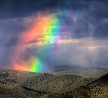 Violent Rainbow -- Sunset storm in the Sangre de Cristos by njordphoto