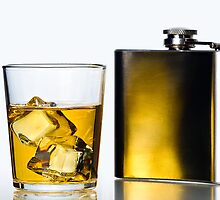 Hip flask and Whisky on the rocks by Gert Lavsen