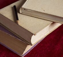 pencil and three books by slavikostadinov