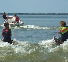 Dad and the boys playing in the water. by ndarby1