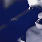 Young lady putting pistol gun in mouth in dark analog film 35mm photograph by edwardolive