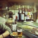 Man tapas and glass of beer in Spanish bar square Hasselblad medium format  c41 color film analogue photo by edwardolive