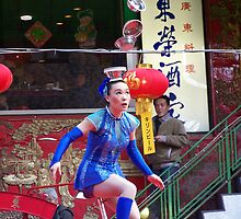 Gymnast balances bowls, onlookers amazed by PouncingAnt