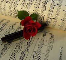 A rose for our Monica by IngridSonja