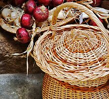 Basket with onions by Silvia Ganora