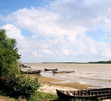 Lonely Boats on the Shore by photographyes